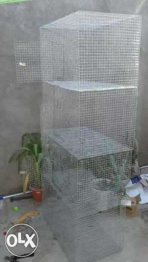 Four Gray Metal Wire Pet Cages