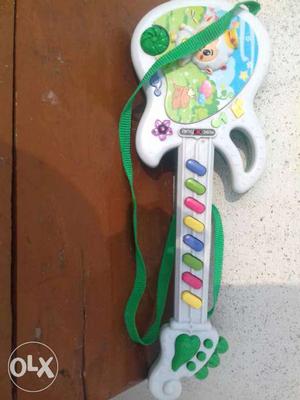 Toddler's White And Green Guitar Toy