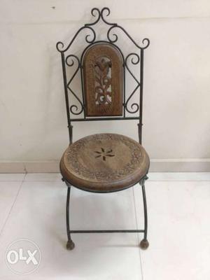A pure wooden folding antique chair in good