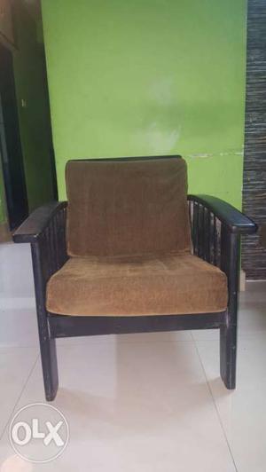 A set of 2 teak wood low seater sofa chairs black
