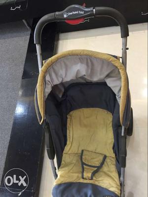 Baby's Black And Yellow Stroller