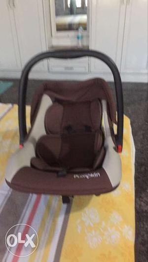 Baby's Brown And Gray Car Seat Carrier
