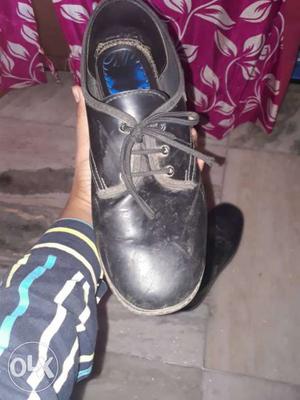 Black leather school shoe of Ajanta in a very