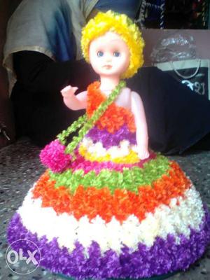 Girl Doll With Multicolored Striped Dress