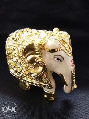 Gold-colored And White Elephant Figurine