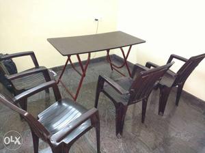 New set of 4 chairs and 1 table, used for less
