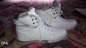 Pair Of White High-top Shoes. Its not used