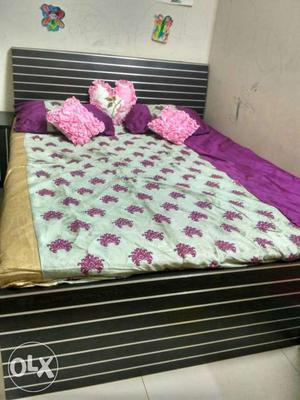 Queen size double bed with storage facility and