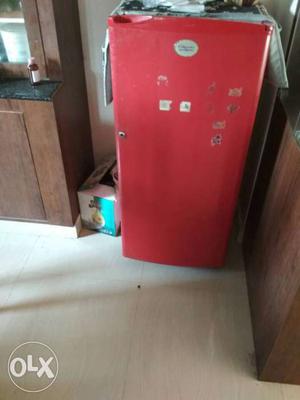 Red Electrolux fridge in good working condition