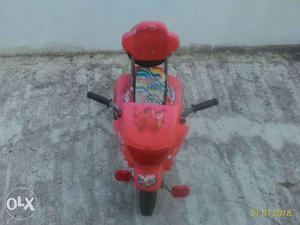 Red three wheel baby bicycle negotiable
