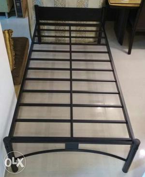 Single metal bed for immediate sale.