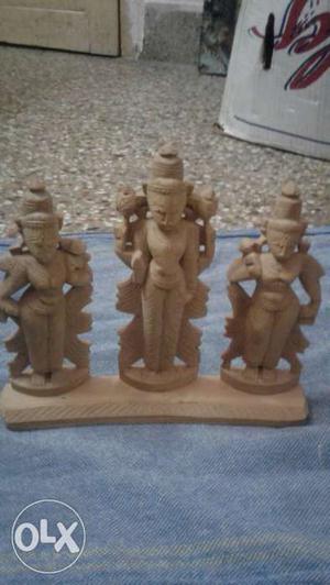 Three Brown Wooden Religious Sculptures