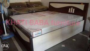 Two White Mattresses With Black Wooden Bed Frame