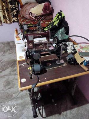 Two big sewing machine with 2 motors and one