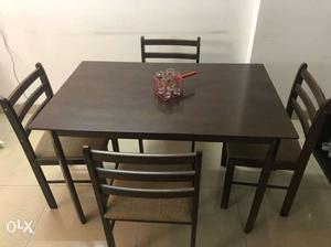 Unused compact 4 seater dining table, with