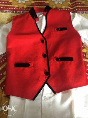 Vest coat red color along with white shirt