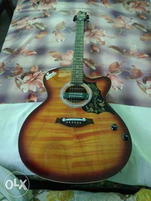 Brown And White Cutaway Guitar