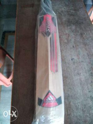 Brown, Black, And Red Wooden Cricket Bat