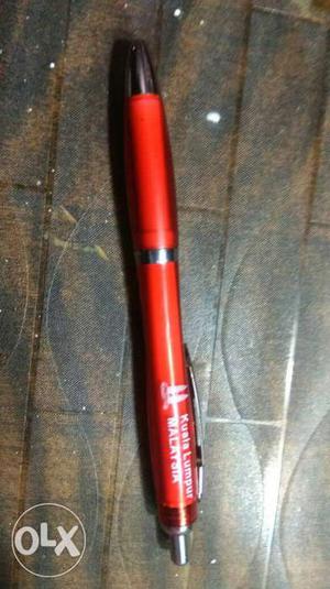 Red And Gray Retractable Pen