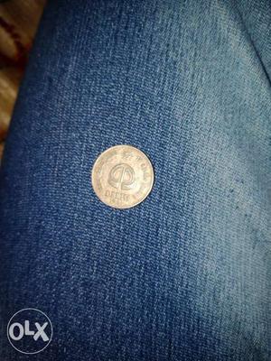 Round Silver-colored Delhi Coin