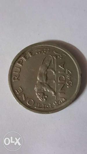 Round Silver-colored  One Rupee Coin