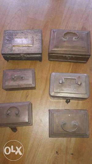 Six Rectangular Brown Steel Cases