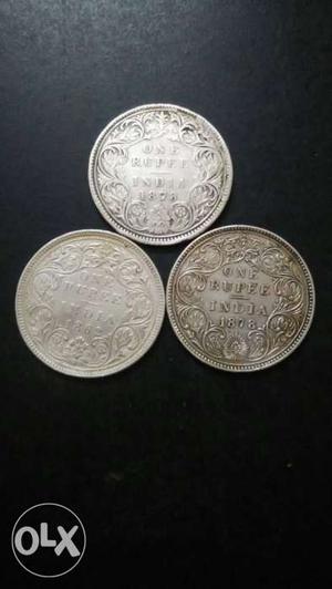 Three Round Silver-colored Indian Coins