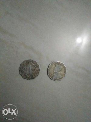 Two Indian Silver-colored Coins