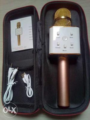White And Gold-colored Wireless Microphone With Case