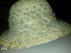 A big pretty beige colour hat for girls. Not used