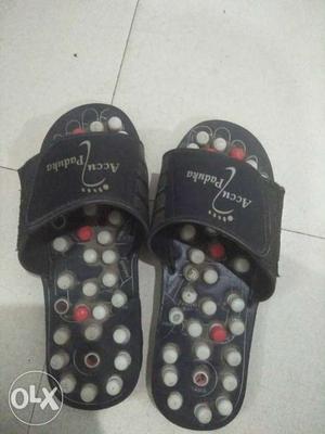 Pair Of Black-red-and-gray Acci Padauka Slide Sandals