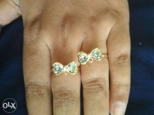 Two Gold-colored Clear Gemstone Encrusted Rings