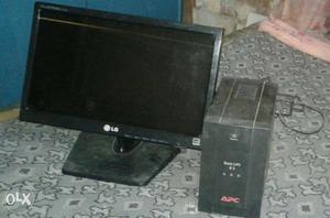 Black LG Flat Screen Computer Monitor With APC UPS