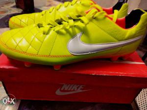 Pair Of Yellow-and-white Nike Soccer Cleats With Box