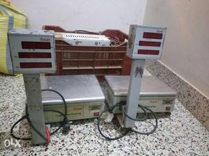 Two electronic weighing machines