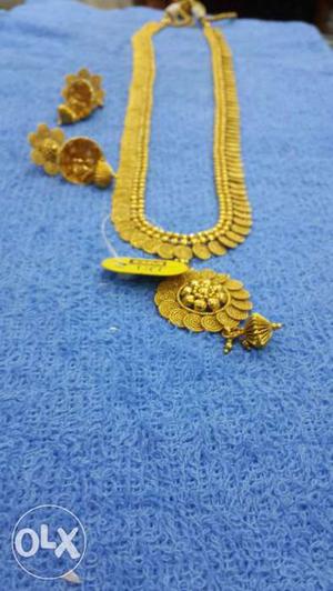 Gold-colored Pendant Necklace And Jhumka Earrings