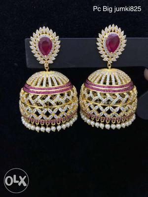 Pair Of Gold-colored Earrings With Purple Gemstone