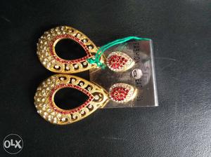 Pair Of Red-and-gold Colored Earrings