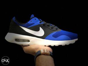 Paired Blue And Black Nike Shoe