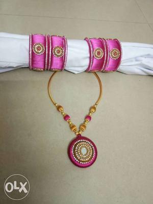 Pink And Gold-colored Bangles And Necklace