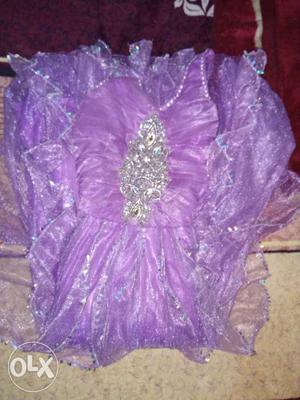Purple coloured gown... alongwith a jacket...