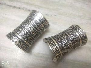 Two Silver-colored Cuff Bracelets