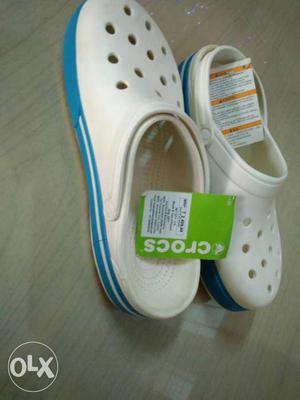 White-and-blue Crocs Rubber Clogs
