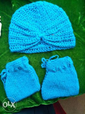 Baby's Blue Knitted Cap And Shoes