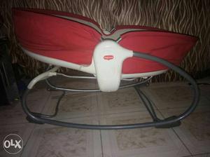 Baby's White And Red Bouncer Seat