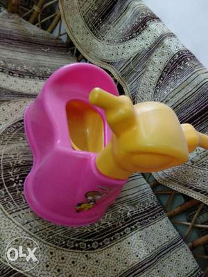 Baby's Yellow And Pink Potty Trainer