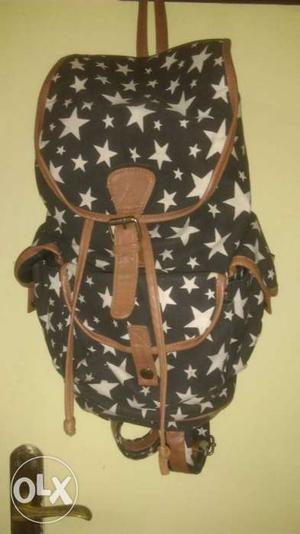 Black, White, And Brown Star Printed Backpack