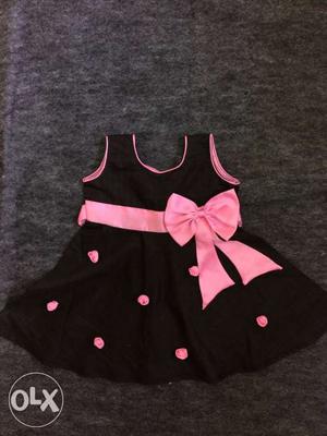 Black and pink baby sleeveless frock for more
