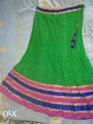 Green color net and valvate party wear lehnga