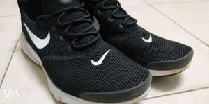Pair Of Black-and-white Nike Sneakers size 10